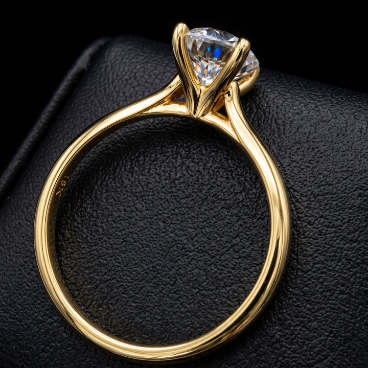 1.37 carat oval lab-grown diamond solitaire engagement ring displayed on a black jewelry background.