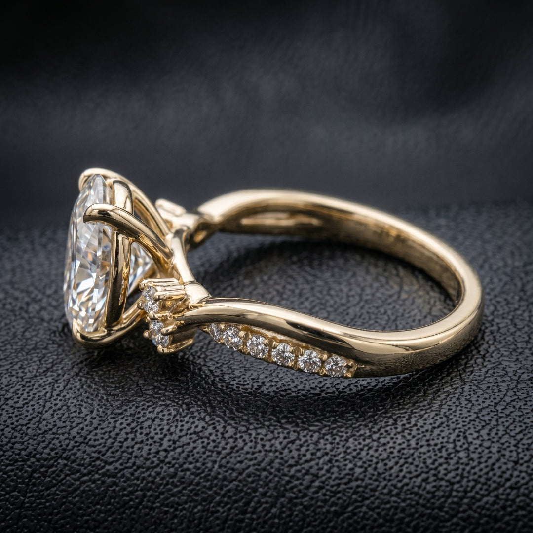 1 carat oval lab-created diamond engagement ring with a twisted gold band and diamond accents