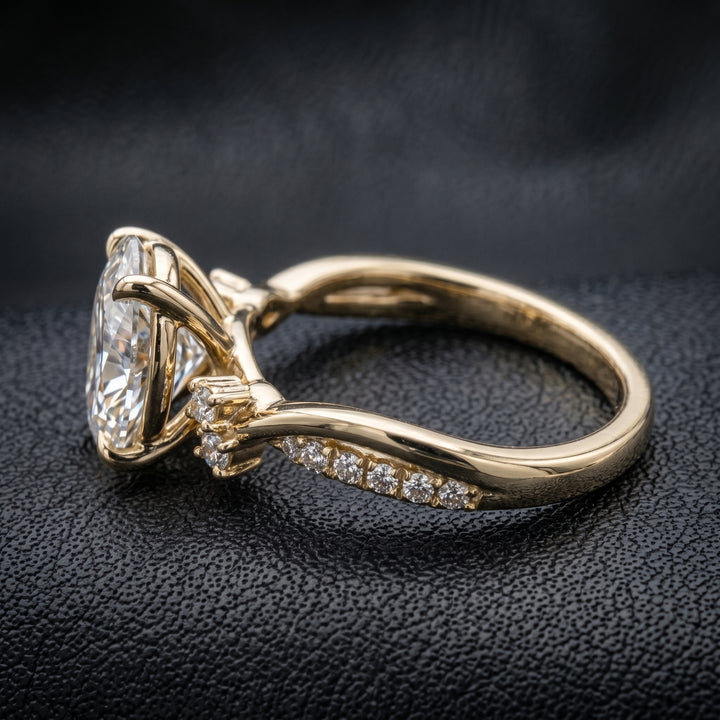 1 carat oval lab-created diamond engagement ring with a twisted gold band and diamond accents