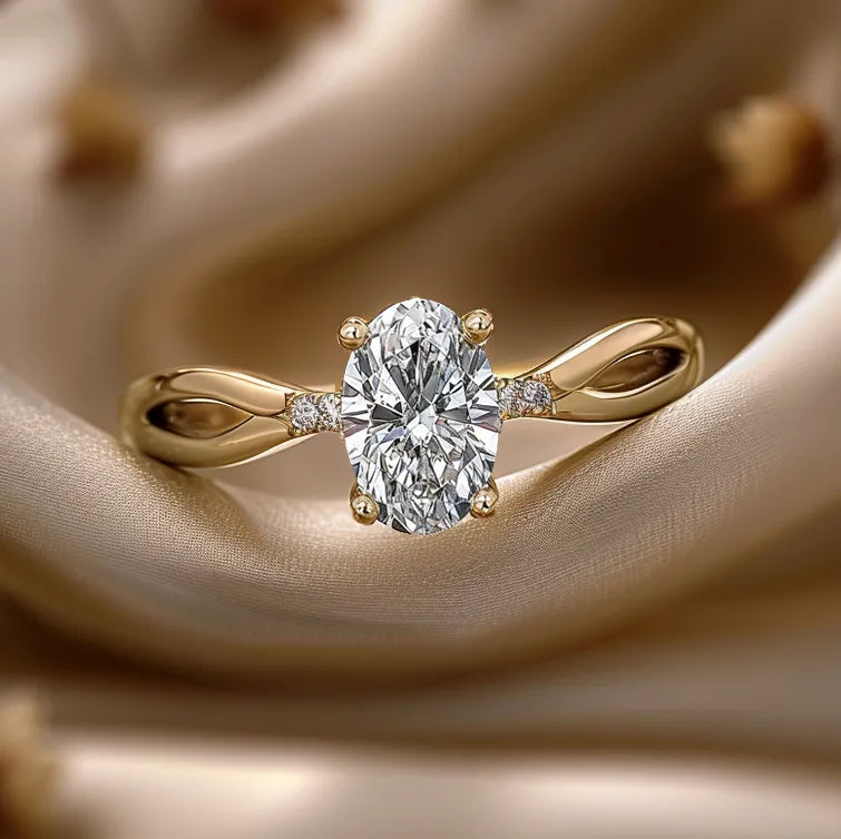 Engagement ring with 0.9 carat oval lab-grown diamond and twist design band.