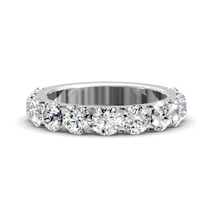 Wide gold pavé band with large round brilliant diamonds in eternity style