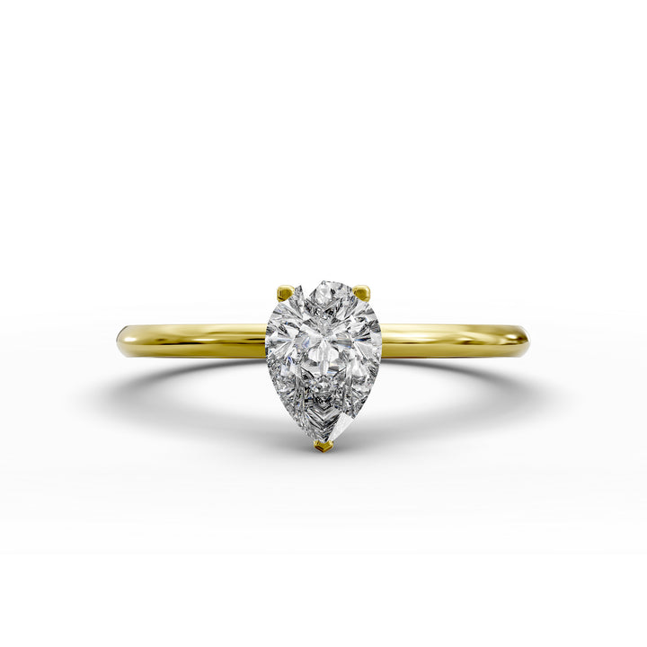 Pear-shaped diamond hidden halo engagement ring with slender band shown in display view.