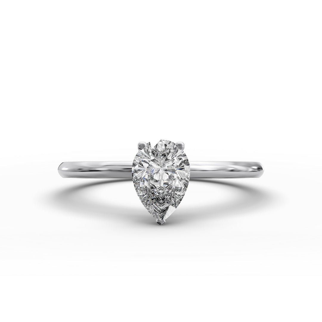 Pear-shaped diamond hidden halo engagement ring with slender band shown in display view.