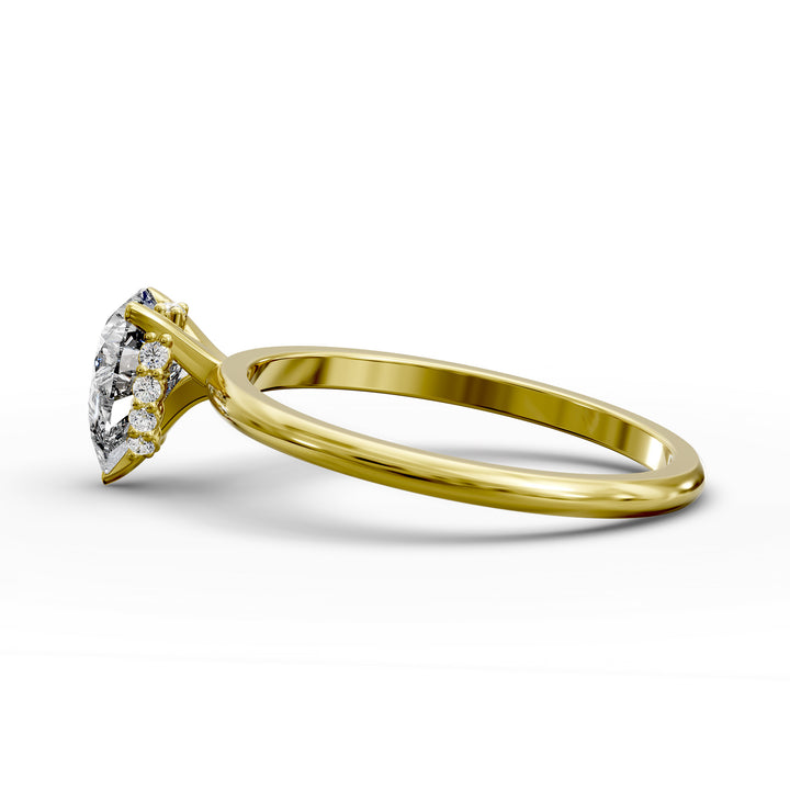 Pear-shaped diamond hidden halo engagement ring with slender band shown in display view.