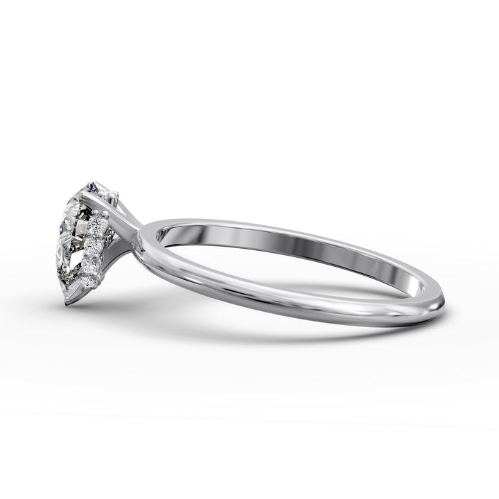 Pear-shaped diamond hidden halo engagement ring with slender band shown in display view.
