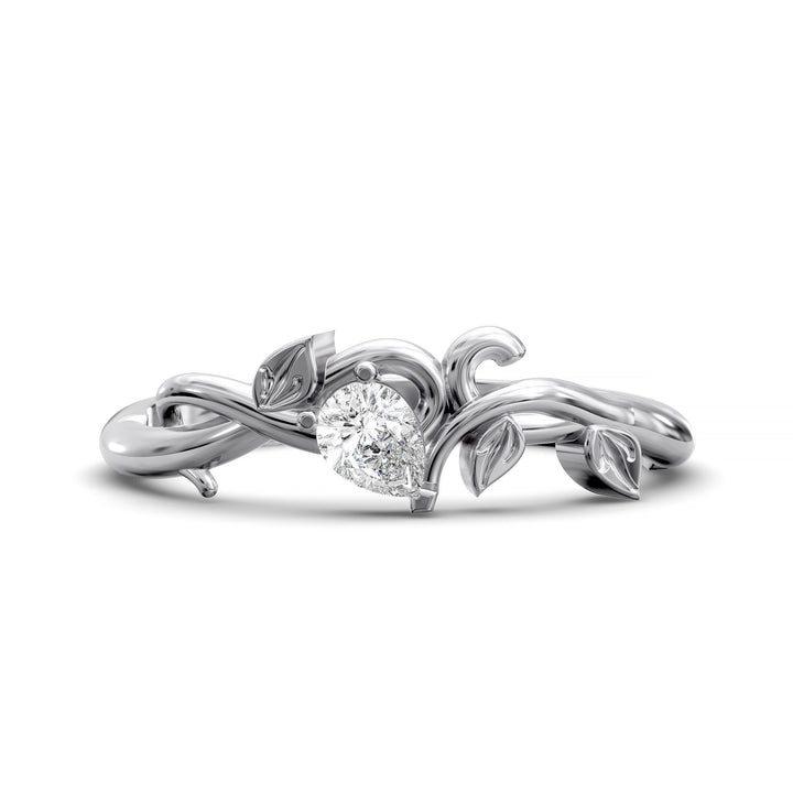 Nature-inspired wedding band with pear-shaped center stone and leaf vine detailing