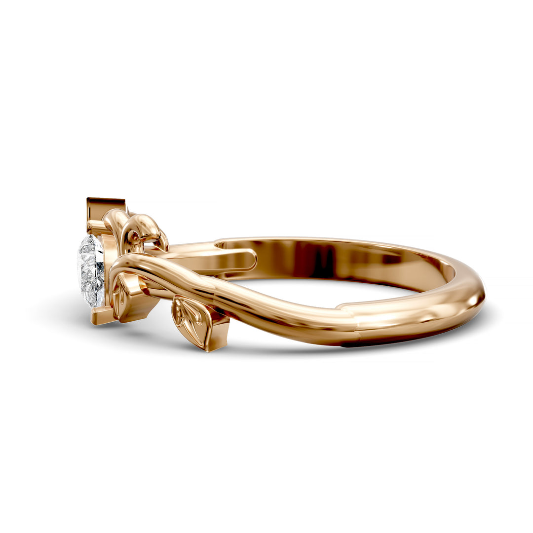 Nature-inspired wedding band with pear-shaped center stone and leaf vine detailing