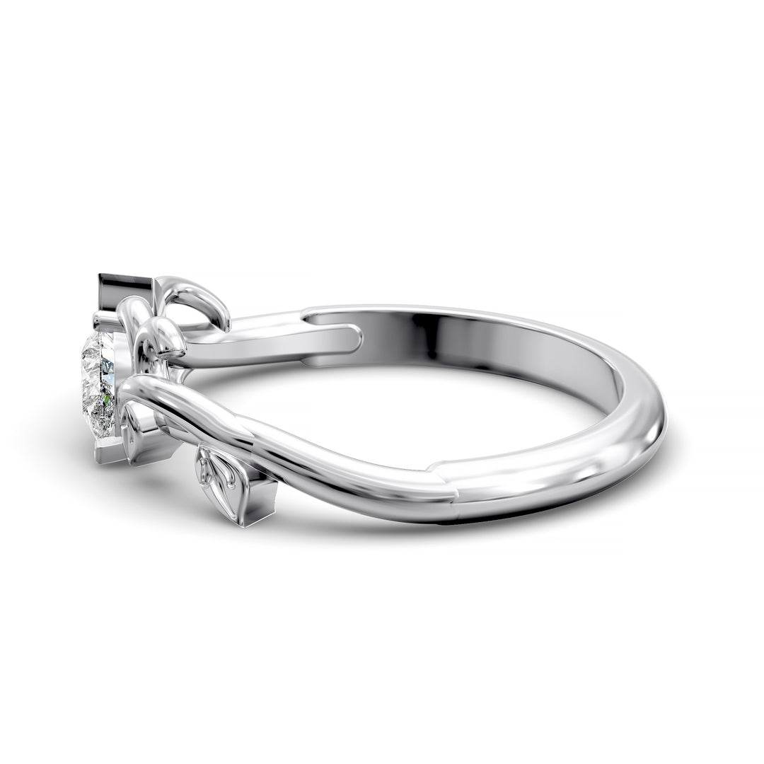 Nature-inspired wedding band with pear-shaped center stone and leaf vine detailing