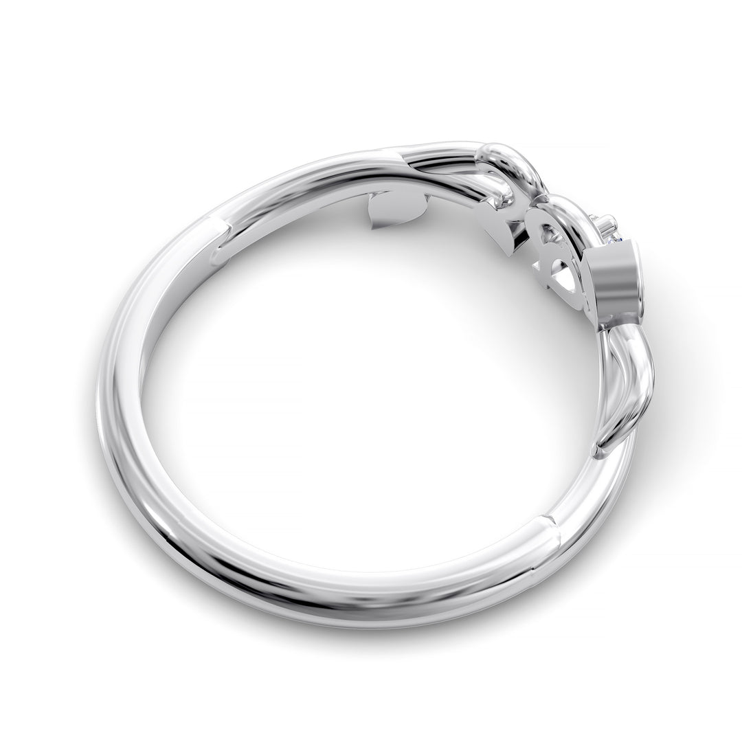 Nature-inspired wedding band with pear-shaped center stone and leaf vine detailing