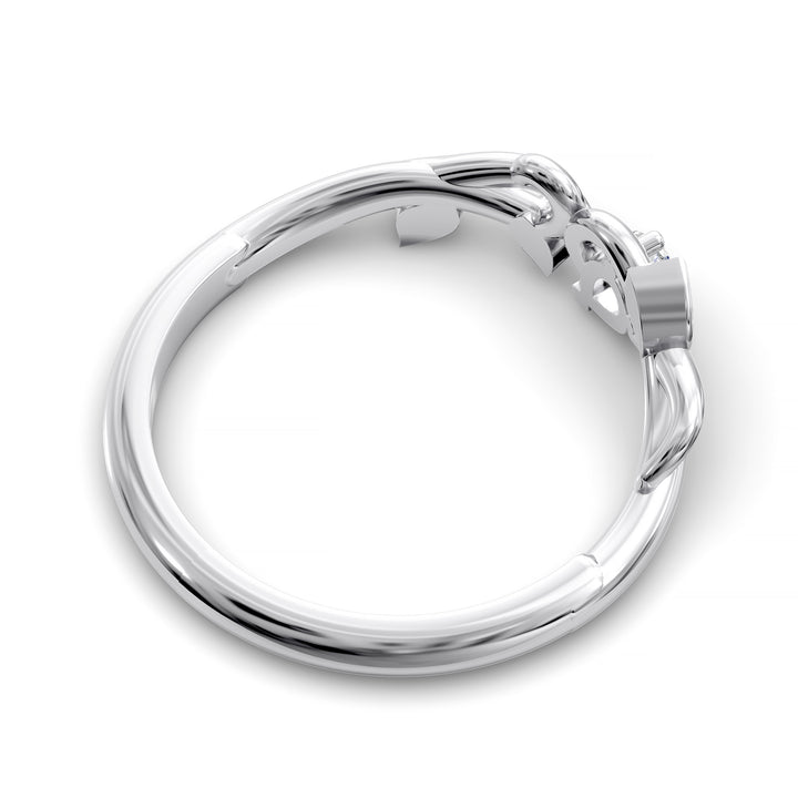 Nature-inspired wedding band with pear-shaped center stone and leaf vine detailing