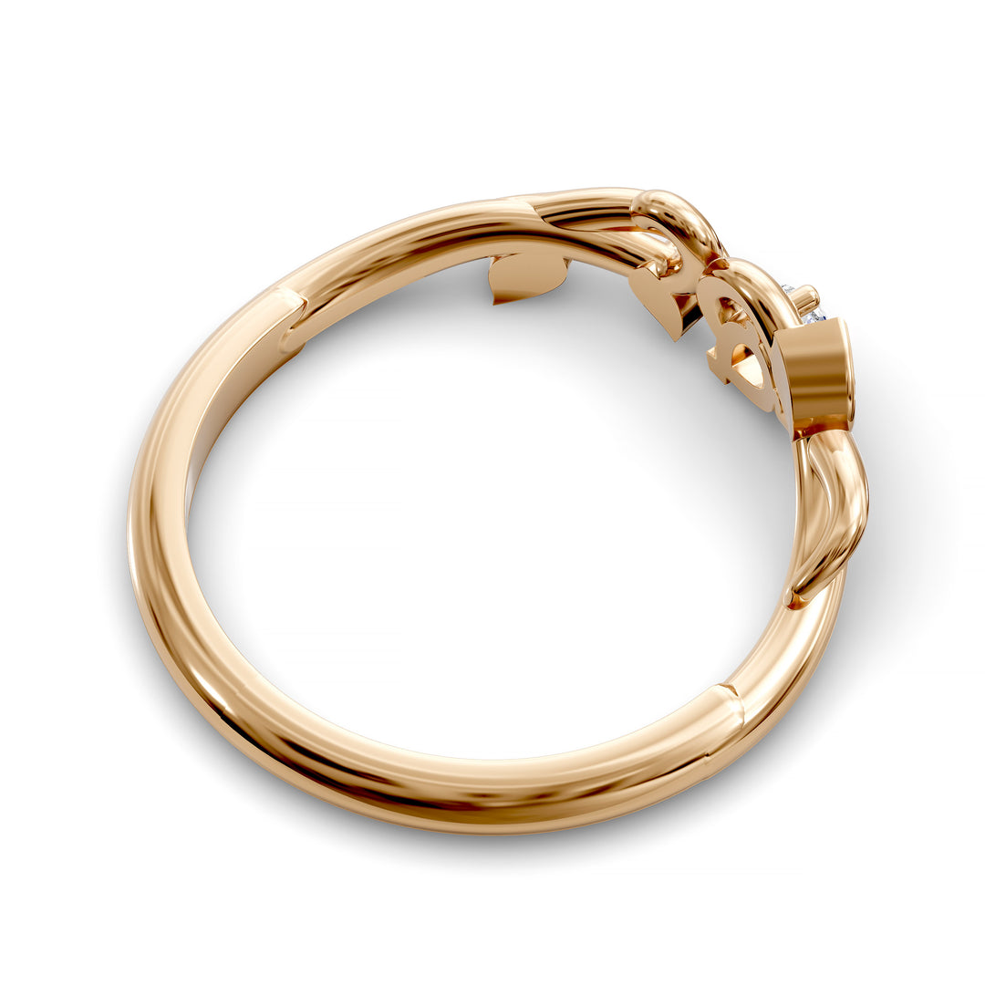 Nature-inspired wedding band with pear-shaped center stone and leaf vine detailing