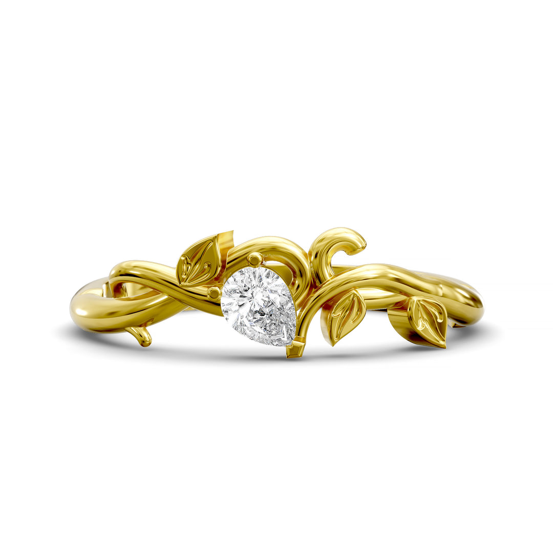 Nature-inspired wedding band with pear-shaped center stone and leaf vine detailing