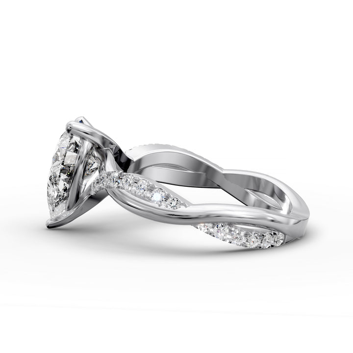 Pear shaped diamond engagement ring with twisted pavé band front view.