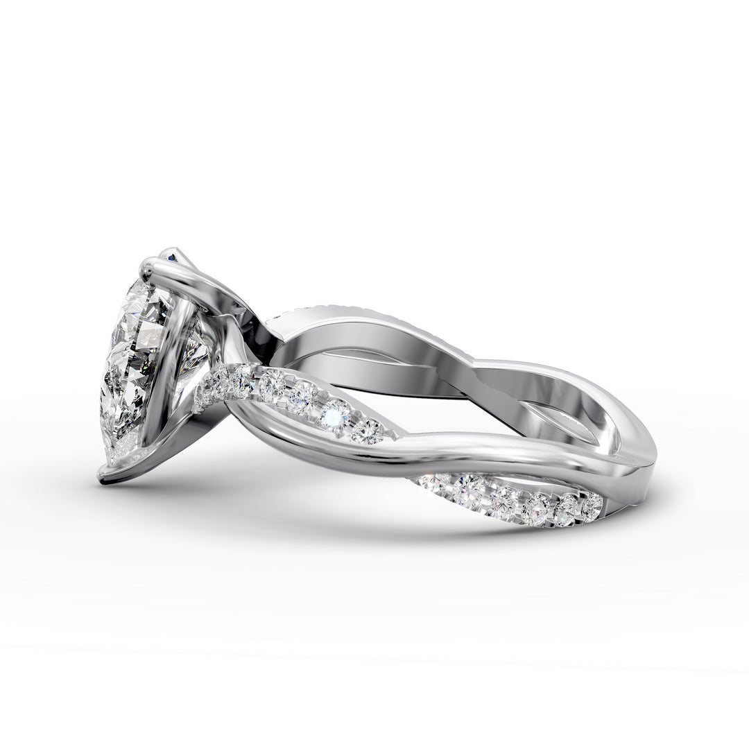 Pear shaped diamond engagement ring with twisted pavé band front view.