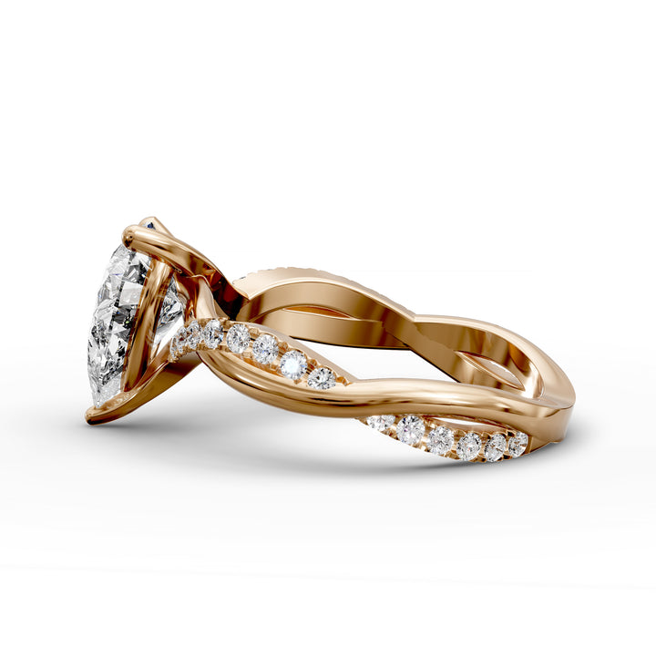 Pear shaped diamond engagement ring with twisted pavé band front view.