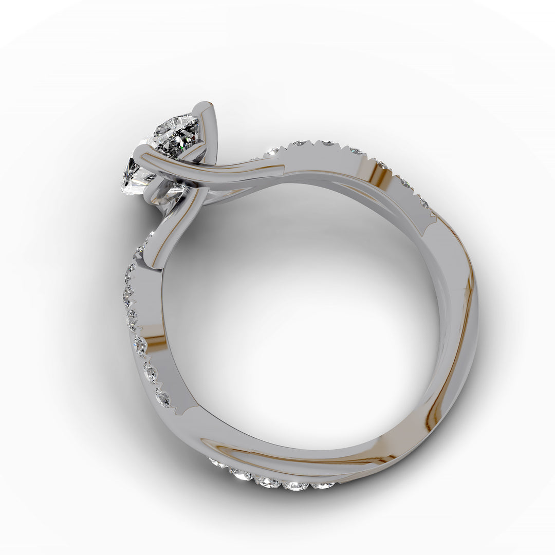 Pear shaped diamond engagement ring with twisted pavé band front view.