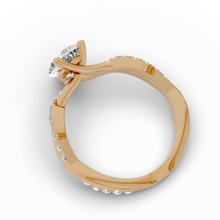 Pear shaped diamond engagement ring with twisted pavé band front view.