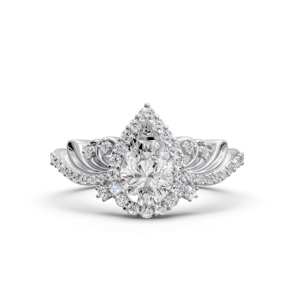 Vintage pear-shaped diamond engagement ring with ornate halo and sculpted detailing.