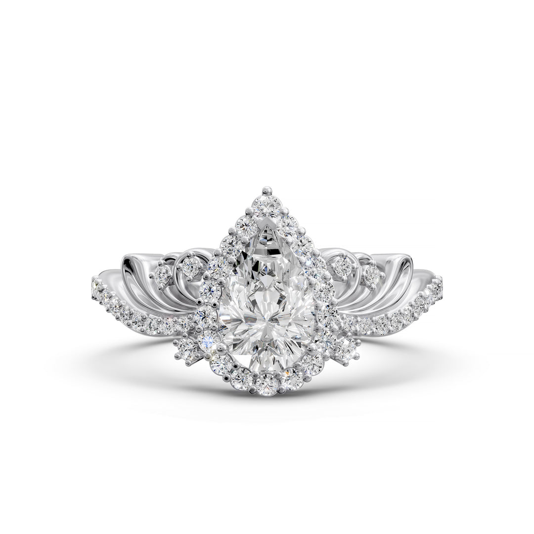 Vintage pear-shaped diamond engagement ring with ornate halo and sculpted detailing.