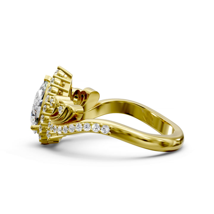 Vintage pear-shaped diamond engagement ring with ornate halo and sculpted detailing.