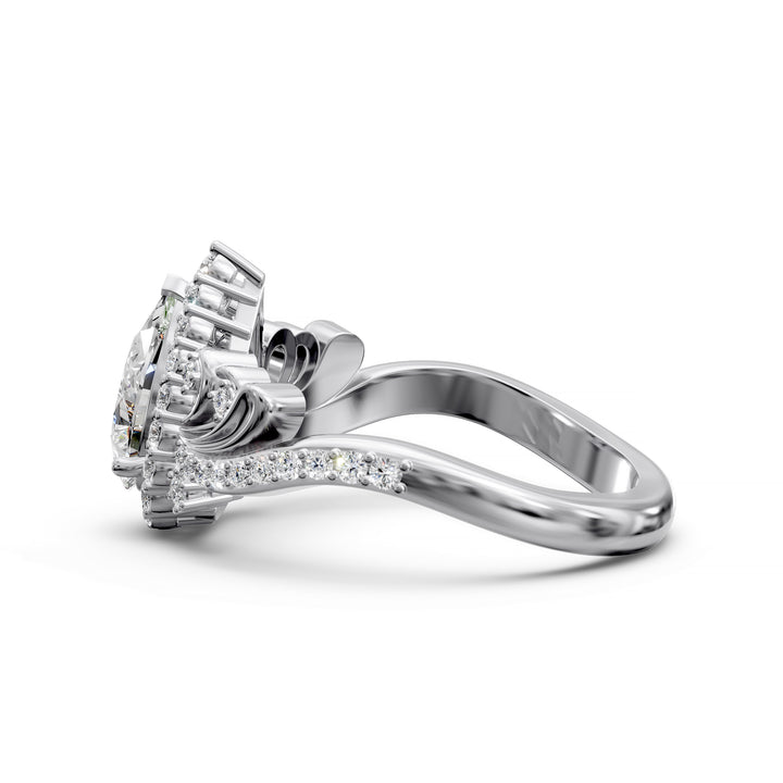 Vintage pear-shaped diamond engagement ring with ornate halo and sculpted detailing.