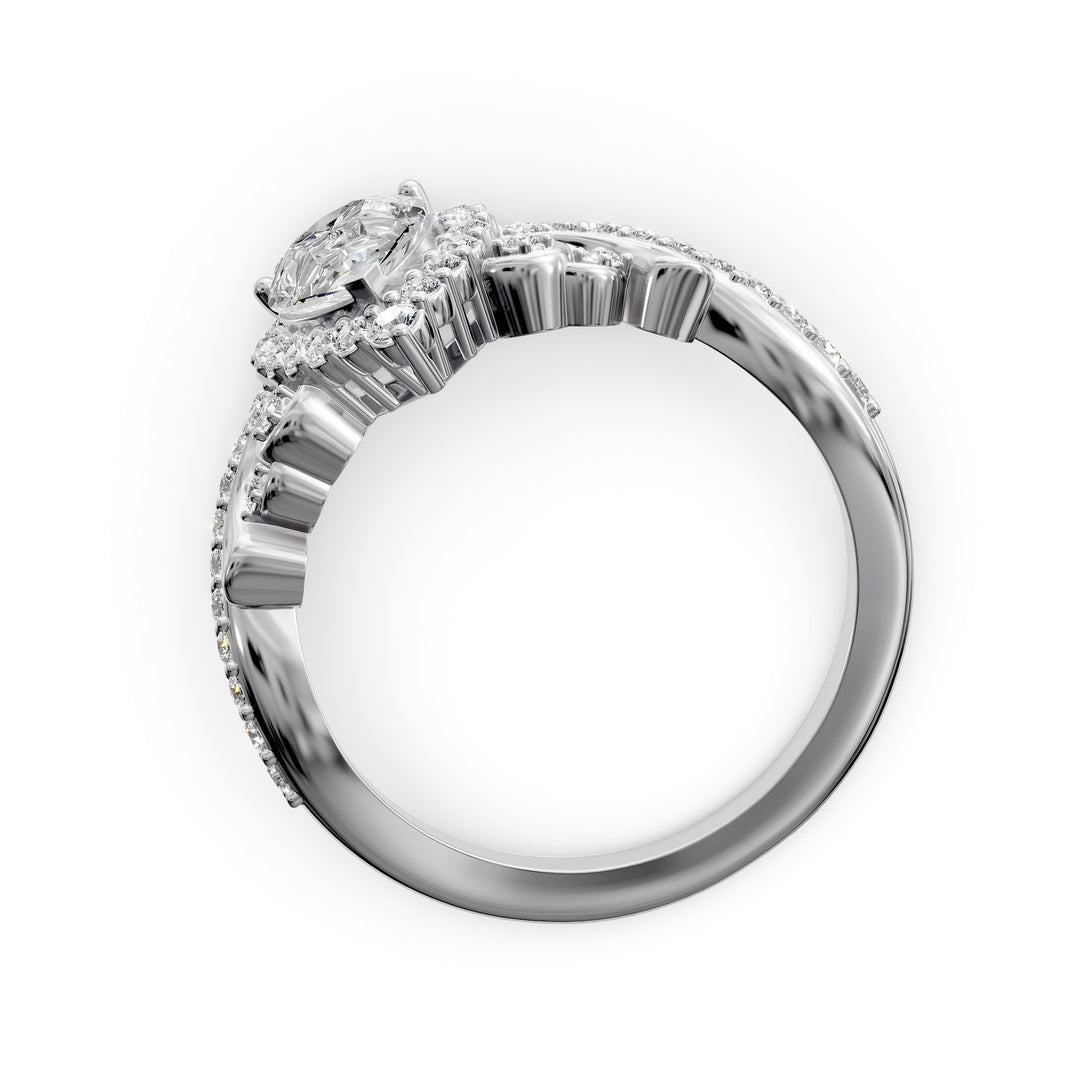 Vintage pear-shaped diamond engagement ring with ornate halo and sculpted detailing.