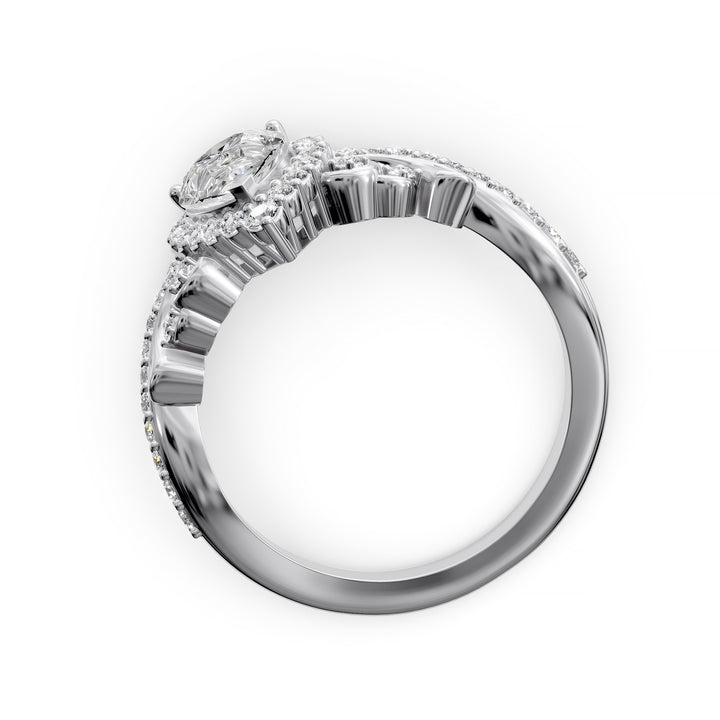 Vintage pear-shaped diamond engagement ring with ornate halo and sculpted detailing.