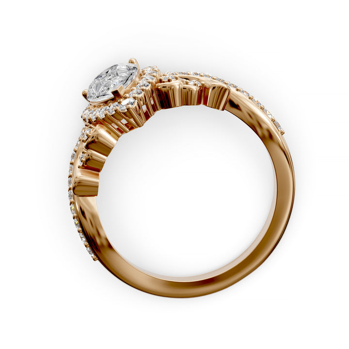 Vintage pear-shaped diamond engagement ring with ornate halo and sculpted detailing.
