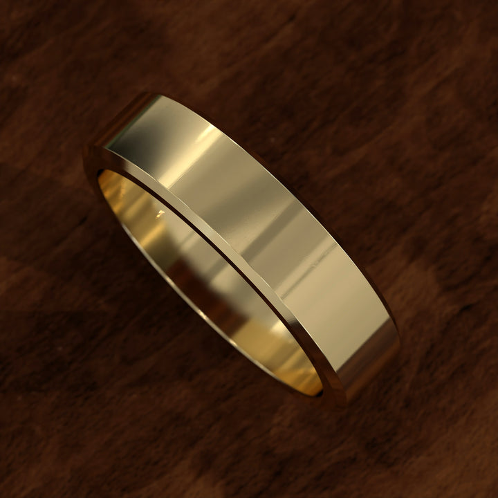 Polished flat men’s wedding band with beveled edges