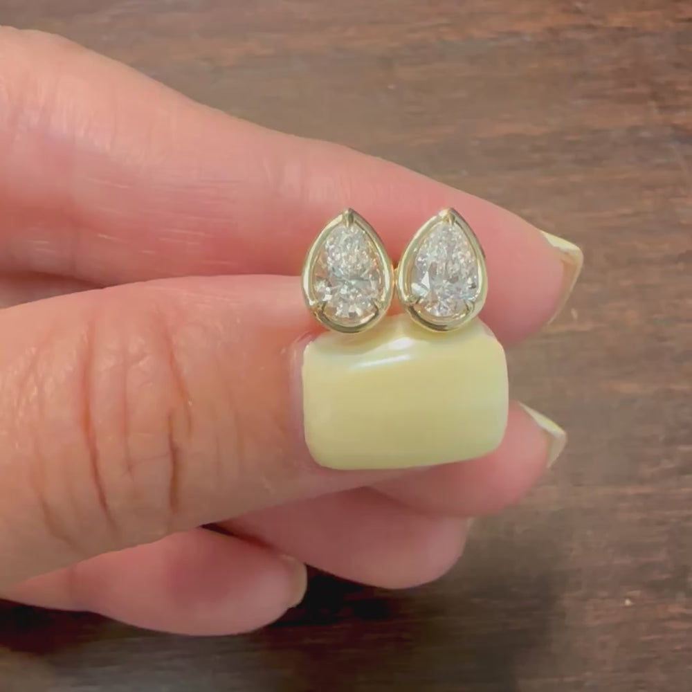 Certified lab grown pear diamond stud earrings in 14K yellow gold bezel setting