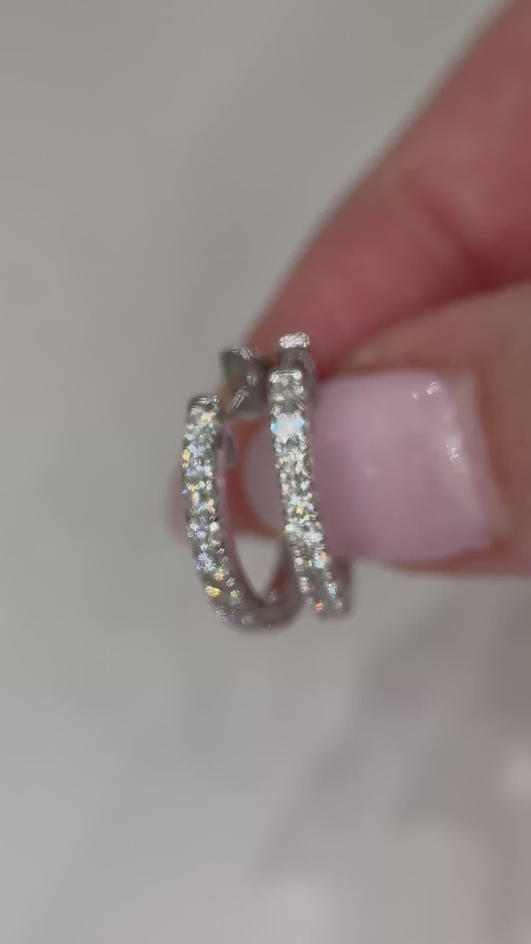 Video of RUDIX 18k white gold natural diamond huggie hoop earrings — muted product clip