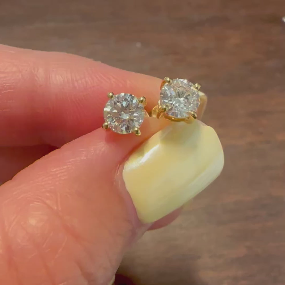 Certified round lab grown diamond stud earrings in 14K yellow gold prong setting

