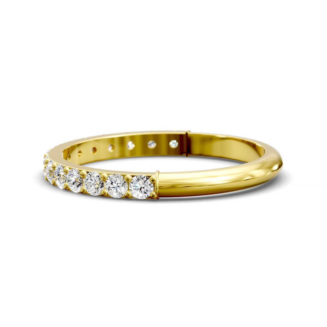 Half eternity band with prong set round diamonds in classic wedding style