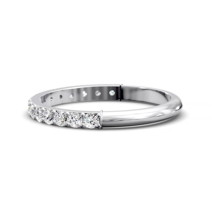 Half eternity band with prong set round diamonds in classic wedding style