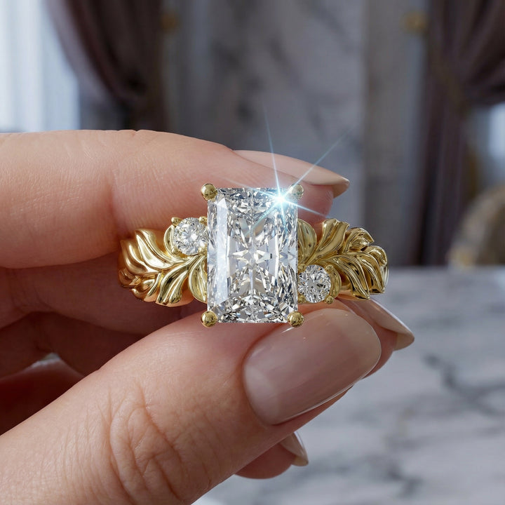 Radiant cut diamond engagement ring with sculpted leaf motif and side stones.