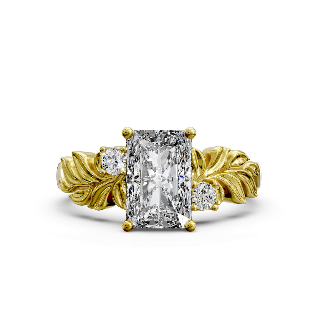 Radiant cut diamond engagement ring with sculpted leaf motif and side stones.