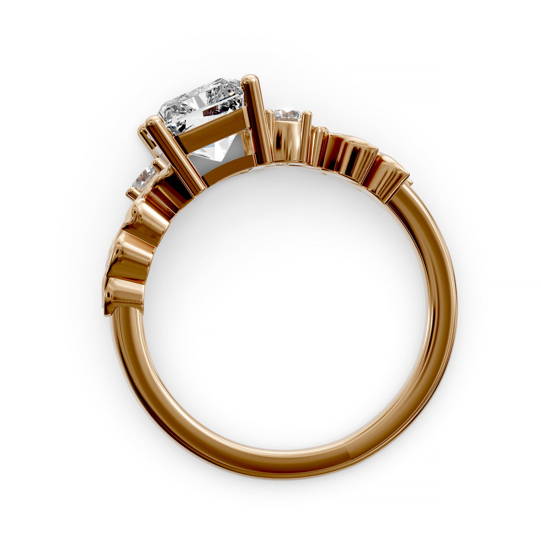 Radiant cut diamond engagement ring with sculpted leaf motif and side stones.