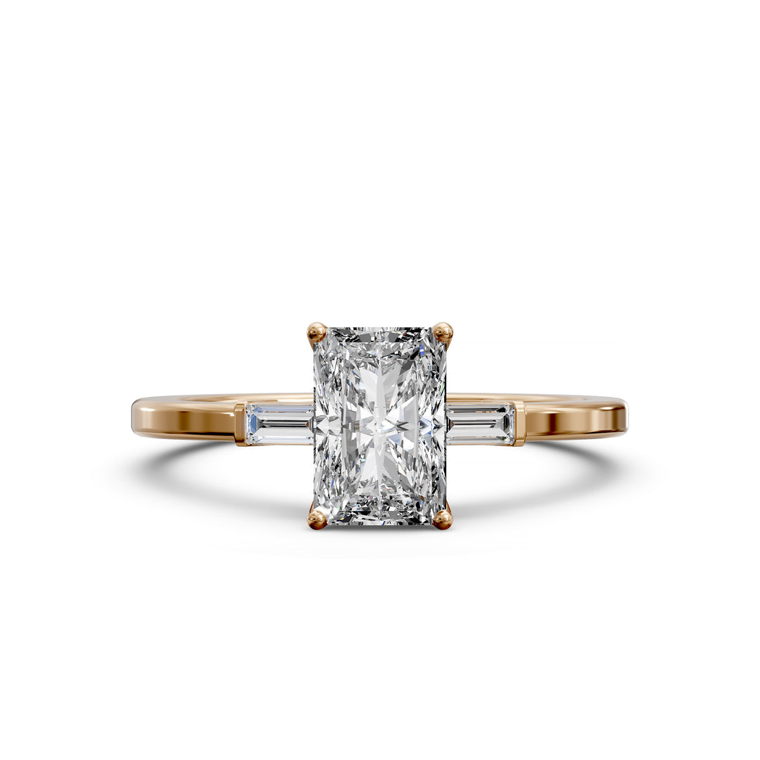Radiant cut three stone engagement ring with tapered side diamonds.