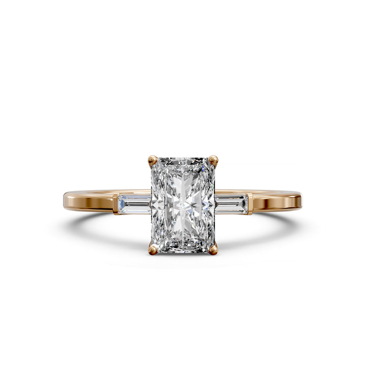 Radiant cut three stone engagement ring with tapered side diamonds.