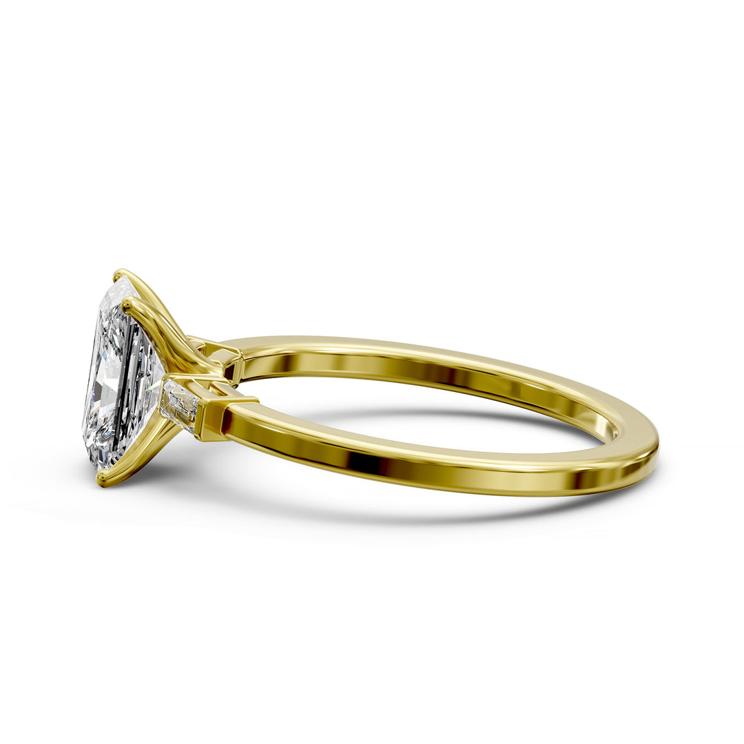Radiant cut three stone engagement ring with tapered side diamonds.