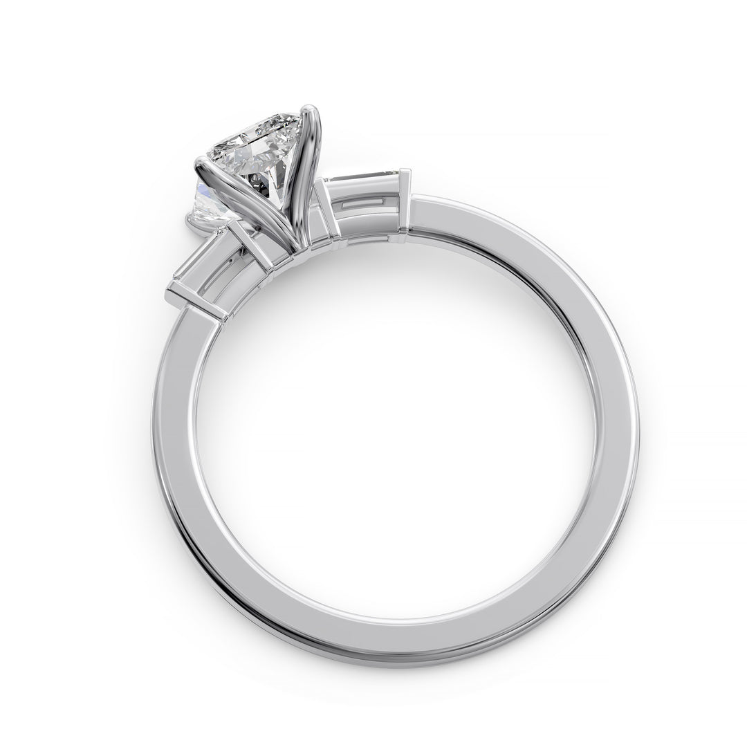 Radiant cut three stone engagement ring with tapered side diamonds.