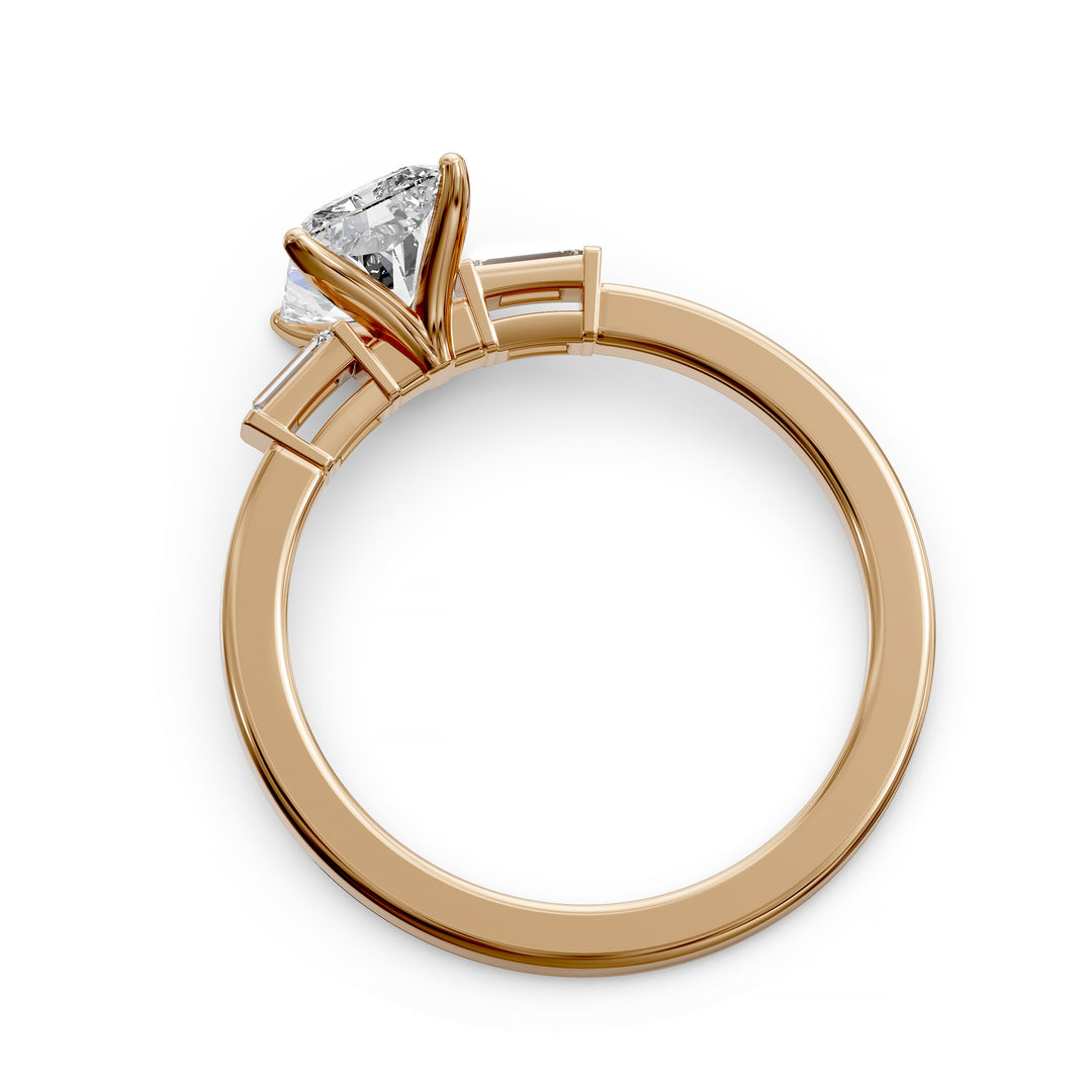 Radiant cut three stone engagement ring with tapered side diamonds.