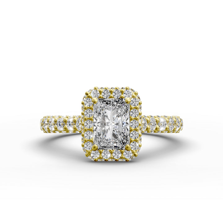 Radiant-cut diamond halo ring with triple prong-set cathedral band shown in front view.