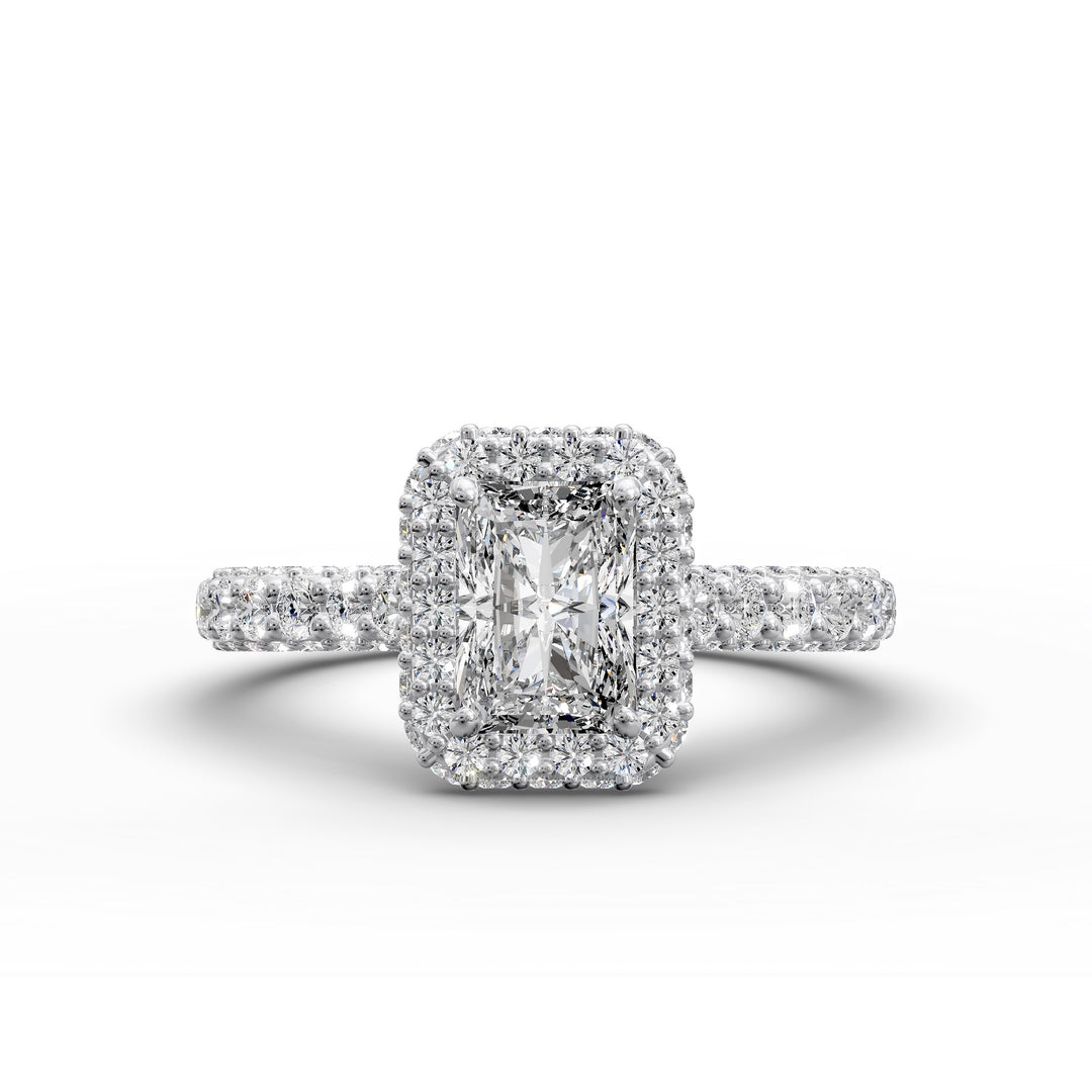 Radiant-cut diamond halo ring with triple prong-set cathedral band shown in front view.