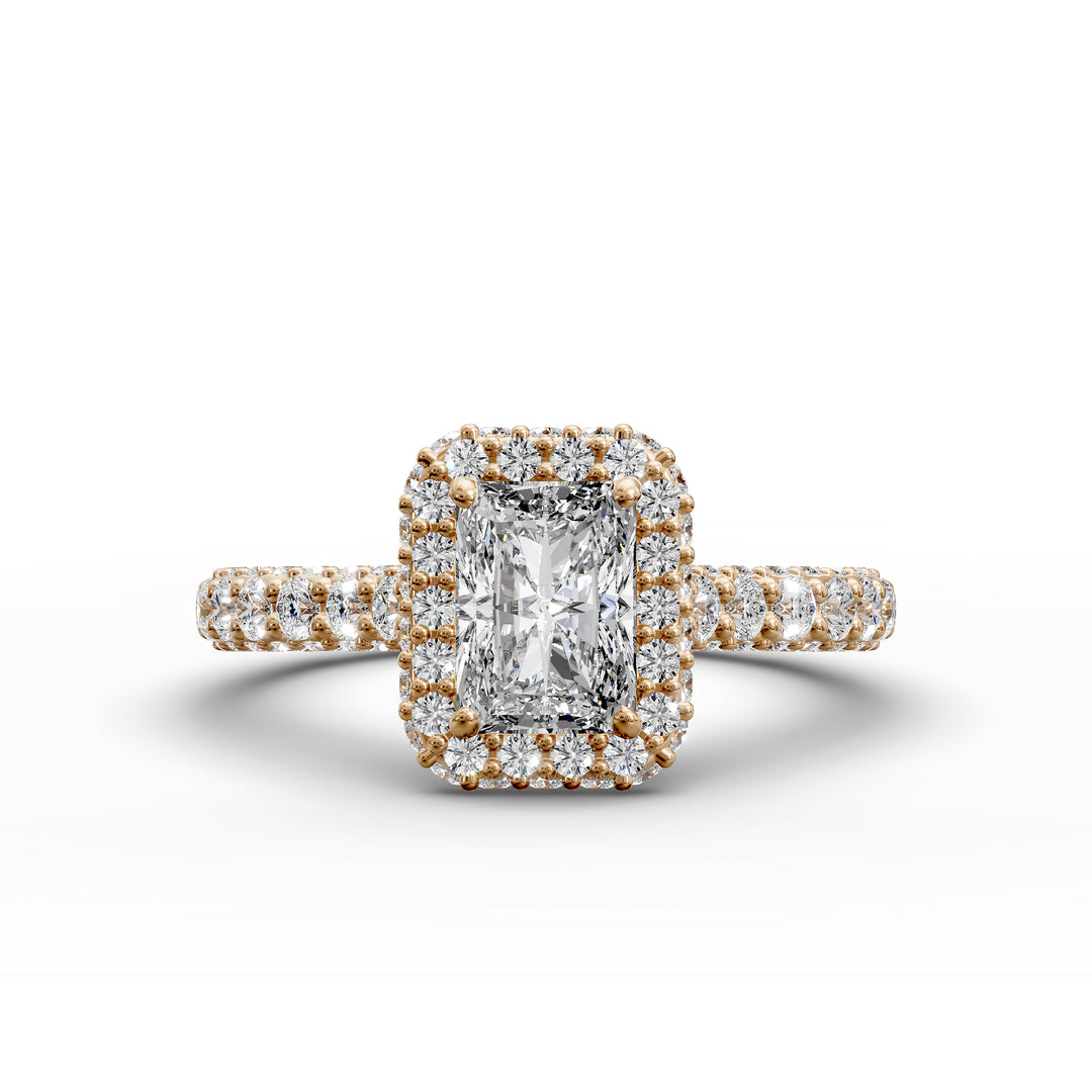 Radiant-cut diamond halo ring with triple prong-set cathedral band shown in front view.