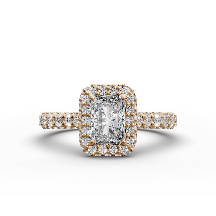 Radiant-cut diamond halo ring with triple prong-set cathedral band shown in front view.
