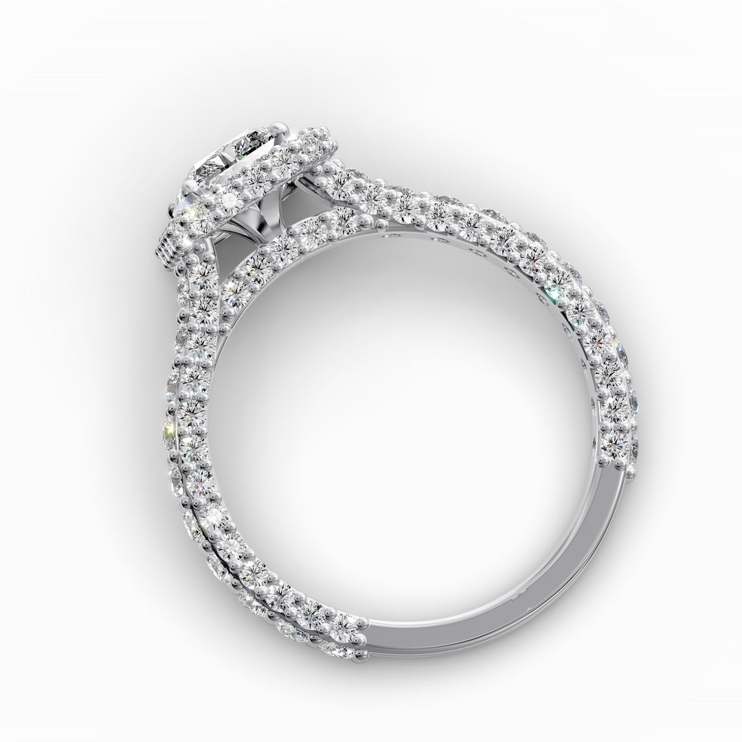 Radiant-cut diamond halo ring with triple prong-set cathedral band shown in front view.
