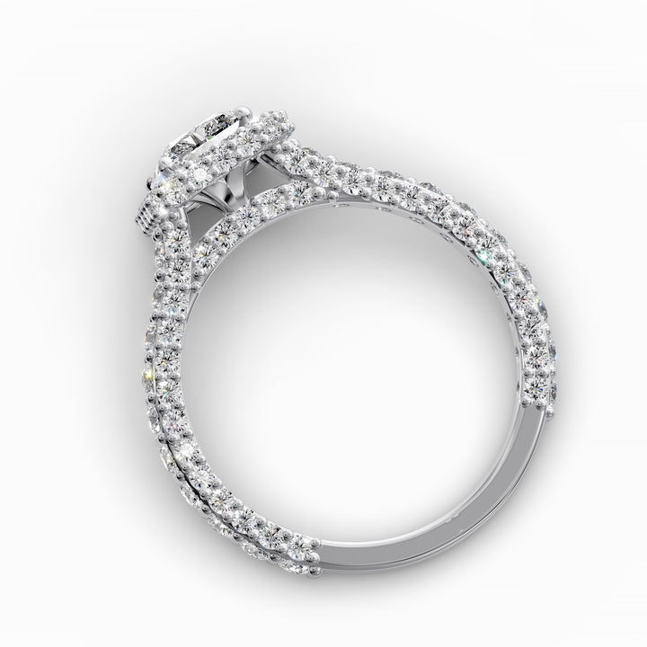 Radiant-cut diamond halo ring with triple prong-set cathedral band shown in front view.