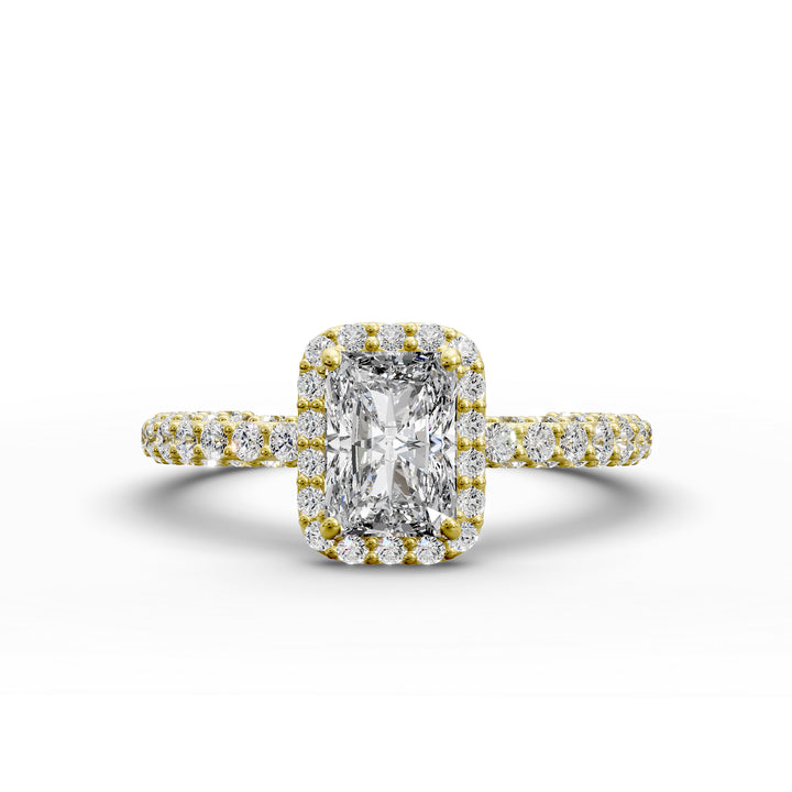 Radiant-cut diamond halo engagement ring with triple prong-set diamond band shown in display view.
