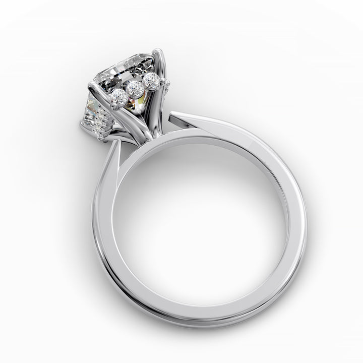 Radiant diamond hidden halo cathedral engagement ring shown in angled display view.